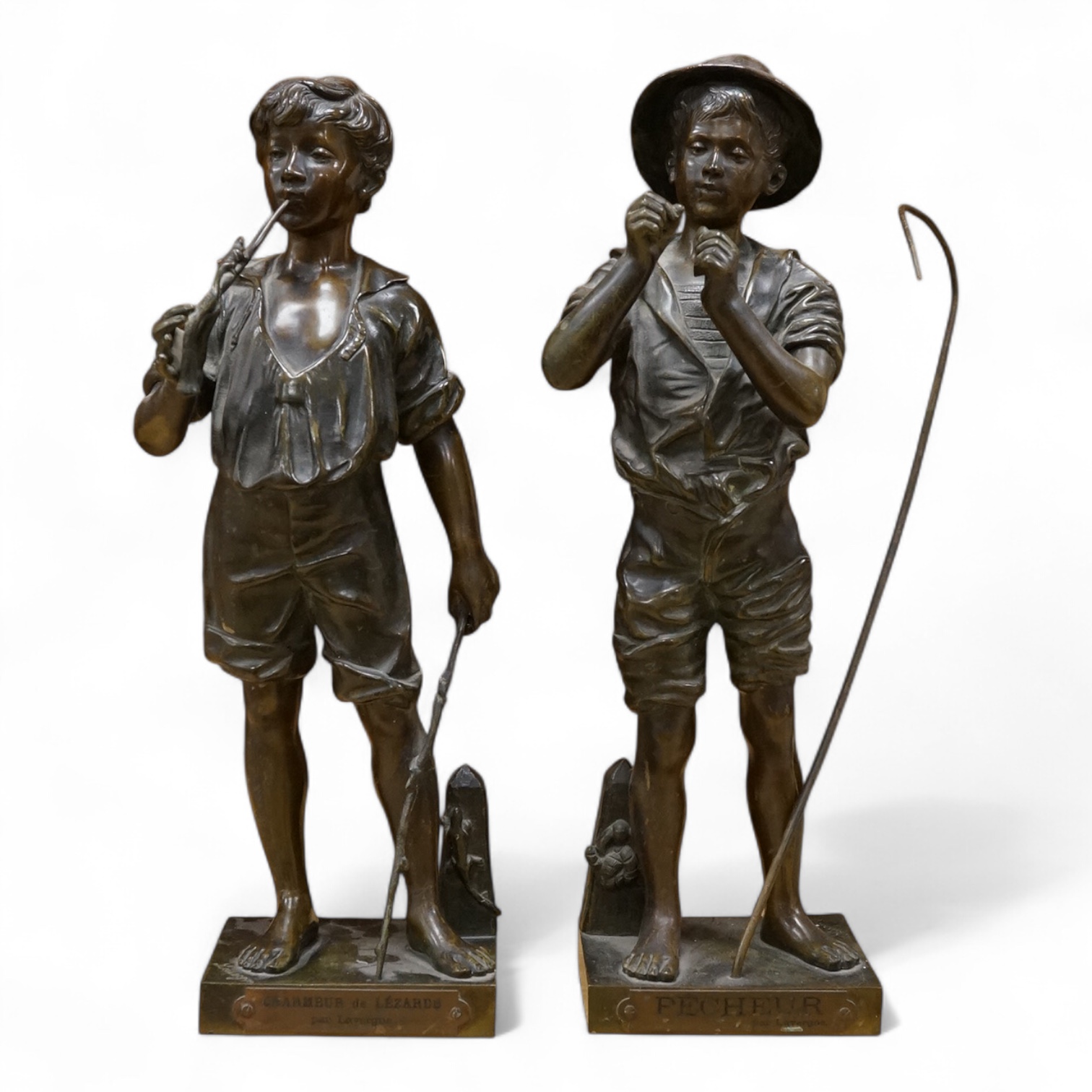 After Lavergne, pair of French bronzes ‘Pecheur’ and ‘Charmeur de lezards’, 41cm high